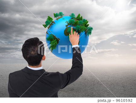 Composite image of asian businessman pointing Composite image of asian businessman pointing 9610592