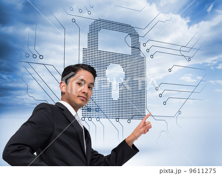 Composite image of unsmiling asian businessman pointing Composite image of unsmiling asian businessman pointing 9611275