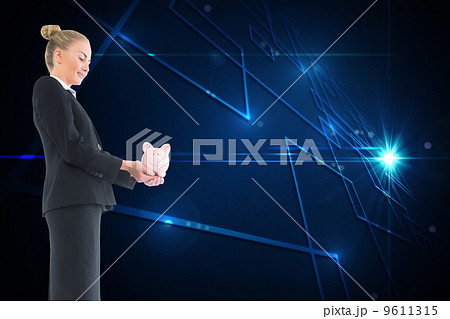 Composite image of businesswoman holding pink piggy bank Composite image of businesswoman holding pink piggy bank 9611315