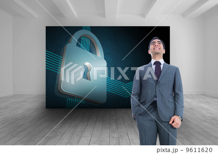 Composite image of smiling businessman standing 9611620