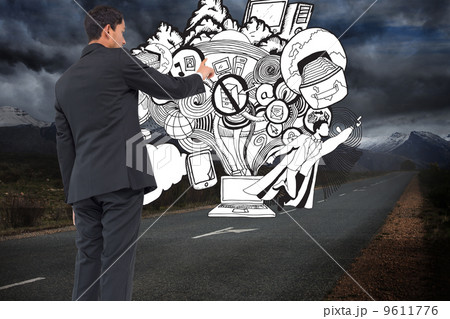 Composite image of serious asian businessman pointing 9611776