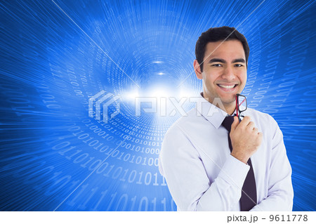 Composite image of smiling businessman holding glasses 9611778