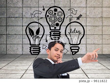 Composite image of thoughtful asian businessman pointing 9611822