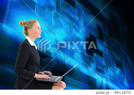 Composite image of businesswoman using laptop 9611870