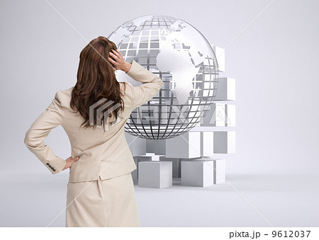 Composite image of businesswoman standing back to camera with ha Composite image of businesswoman standing back to camera with ha 9612037