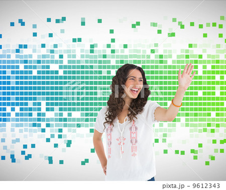 Composite image of cheerful attractive brunette smiling while gr Composite image of cheerful attractive brunette smiling while gr 9612343