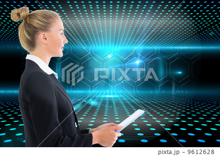 Composite image of businesswoman holding tablet Composite image of businesswoman holding tablet 9612628