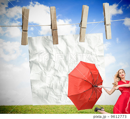 Composite image of elegant blonde holding umbrella Composite image of elegant blonde holding umbrella 9612773