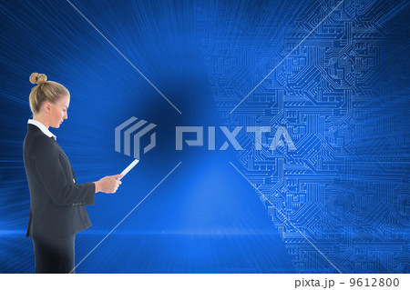 Composite image of businesswoman holding new tablet 9612800