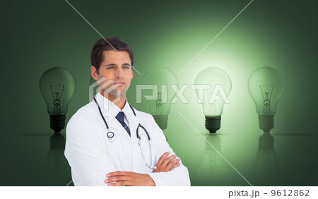 Composite image of serious doctor with arms crossed Composite image of serious doctor with arms crossed 9612862