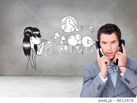 Composite image of angry businessman tangle up in phone wires 9612978