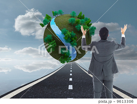 Composite image of businessman with arms raised 9613306