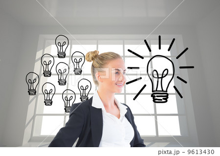 Composite image of businesswoman standing with hands on hips Composite image of businesswoman standing with hands on hips 9613430