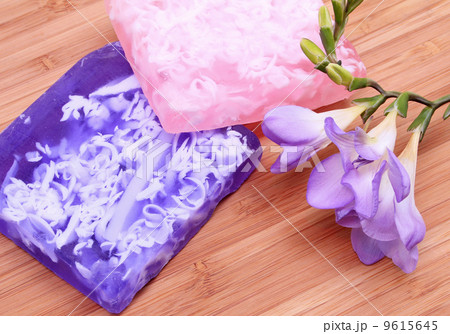 Lilac and pink soap on wooden background in a spa composition Lilac and pink soap on wooden background in a spa composition 9615645