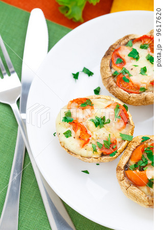 Mushrooms stuffed with mozzarella and tomato Mushrooms stuffed with mozzarella and tomato 9617620