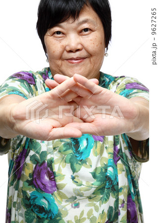 Senior woman doing a series of warm-up exercises 9627265