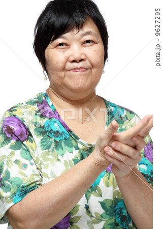 Senior woman doing a series of warm-up exercises 9627295