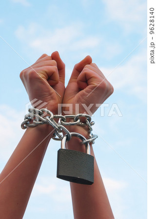 Hands tied up with chains 9628140