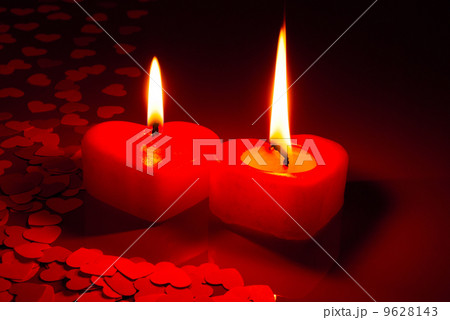 Two burning heart shaped candles Two burning heart shaped candles 9628143