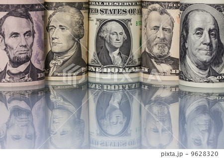 The US dollar banknotes on the glass table 9628320