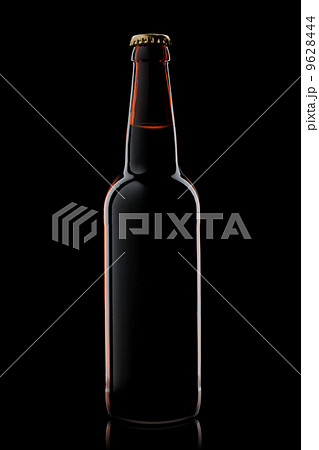 Beer bottle isolated on black 9628444