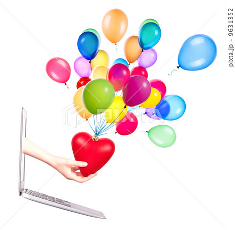 hand with a heart - gift and laptop 9631352
