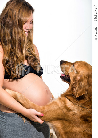 young pregnant pan-asian woman with pet dog young pregnant pan-asian woman with pet dog 9632757