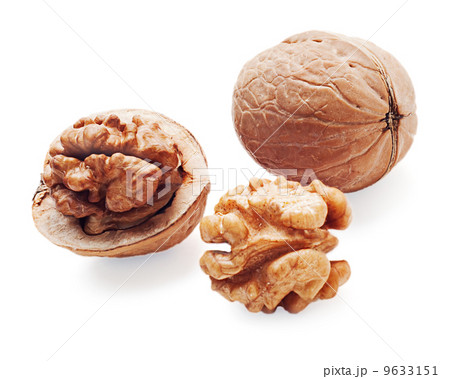 walnut and a cracked walnuts  isolated on the white background 9633151