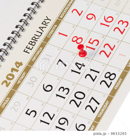 Calendar page with red thumbtack on February 14 2014. Calendar page with red thumbtack on February 14 2014. 9633265