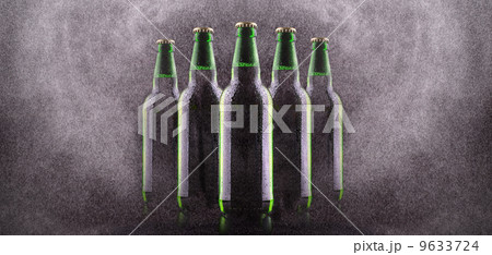 Bottle of beer with drops 9633724