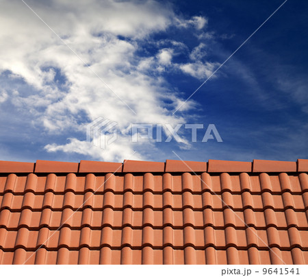 Roof tiles and sky with clouds 9641541