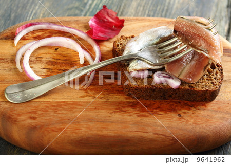 Fork with anchovies closeup. Fork with anchovies closeup. 9641962