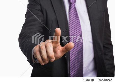 Businessman pointing against white background Businessman pointing against white background 9650692