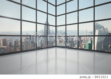 Room with large window showing city 9651021