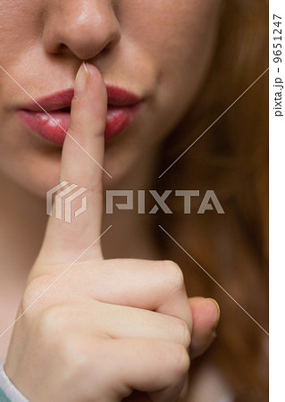 Redhead student asking for silence extreme close up 9651247