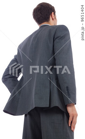 Businessman standing with hand on hip 9651404