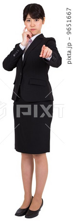 Focused businesswoman pointing 9651667