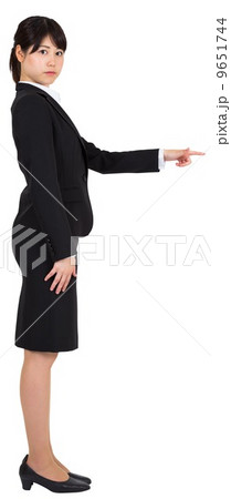 Focused businesswoman pointing Focused businesswoman pointing 9651744