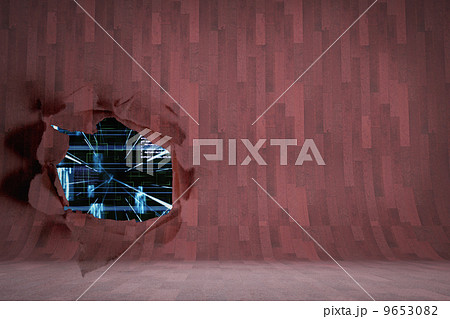 Rip on wall showing technology interface 9653082
