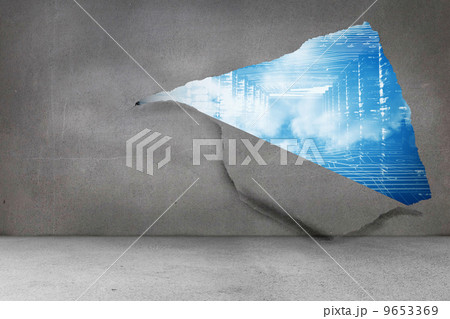 Rip on wall showing technology interface 9653369