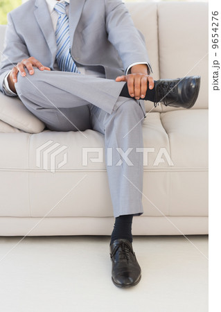 Businessman on couch Businessman on couch 9654276
