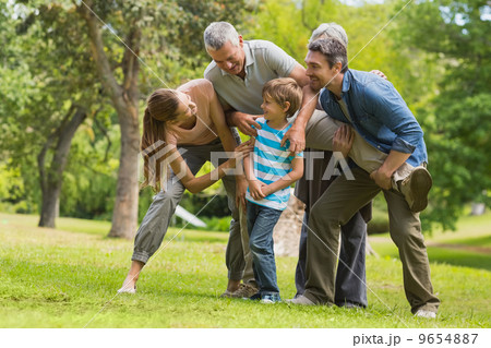 Family playing in park 9654887