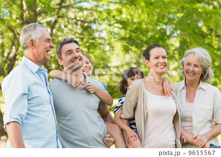 Portrait of cheerful extended family in park Portrait of cheerful extended family in park 9655567