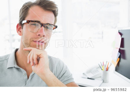 Portrait of a serious casual male photo editor 9655982