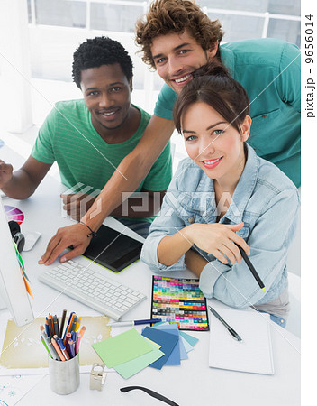 Portrait of three smiling artists at the office 9656014