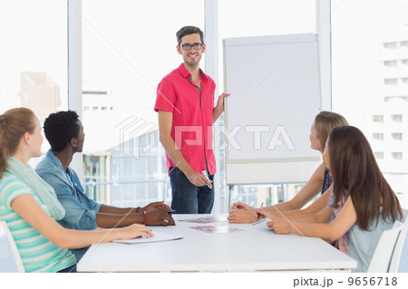 Casual business people in office at presentation Casual business people in office at presentation 9656718