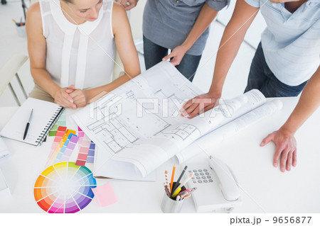 Mid section of artists working on designs Mid section of artists working on designs 9656877