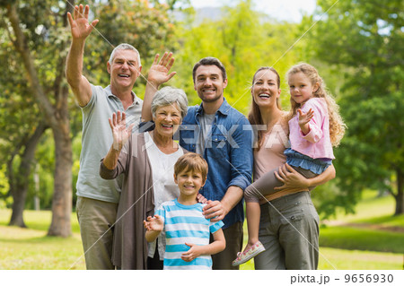 Extended family waving hands in park Extended family waving hands in park 9656930