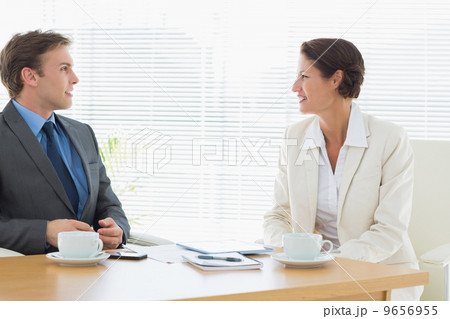 Smartly dressed couple in a business meeting Smartly dressed couple in a business meeting 9656955