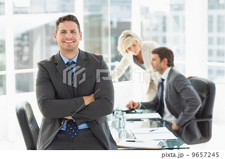 Businessman with colleagues discussing in office Businessman with colleagues discussing in office 9657245